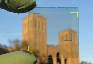 A sample of the new solar cell on a piece of glass. Photo Credit: UCLA