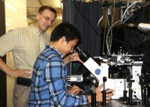 Dr. Anton Malko (left) works in the lab with Hue Minh Nguyen, a physics graduate student who has assisted in the research. Credit: UT Dallas