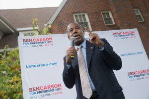 AMES, IA - OCTOBER 24:  Republican presidential candidate Ben Carson speaks outside the Alpha Gamma Rho house during a campaign stop at Iowa State University on October 24, 2015 in Ames, Iowa. A recent poll indicates that Carson has surged past Donald Trump to lead the race for the Republican presidential nomination in Iowa.  (Photo by Scott Olson/Getty Images) 587750043